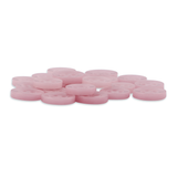 A pile of Replacement Shirt Buttons, round and pink, are scattered on a white background—each one echoing the playful charm of classic poly-nylon buttons from a tailor's kit.