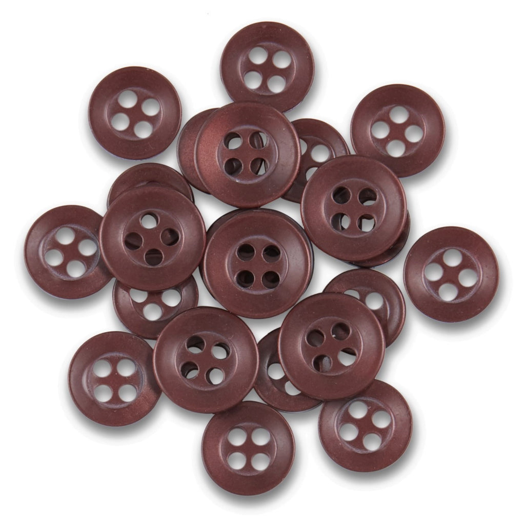 A collection of Replacement Shirt Buttons with a brown matte finish is spread out on a white background.