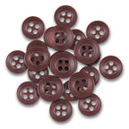 A collection of Replacement Shirt Buttons with a brown matte finish is spread out on a white background.