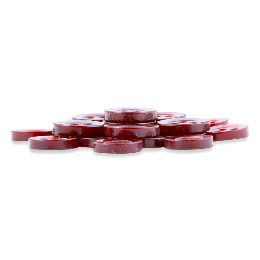 A neat pile of glossy, round red Replacement Shirt Buttons is arranged on a white background.