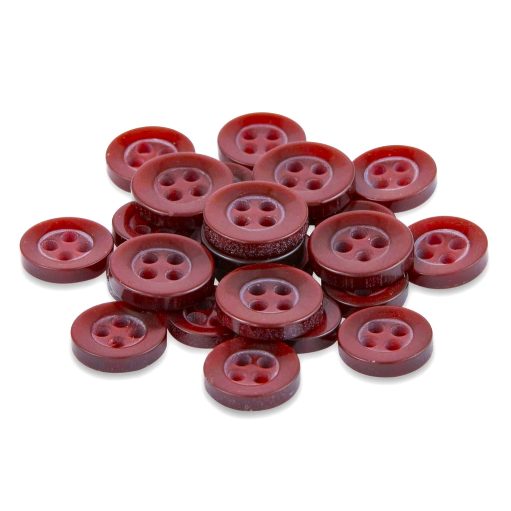 A pile of Replacement Shirt Buttons, round and red with a matte finish and four holes, rests on a white background.