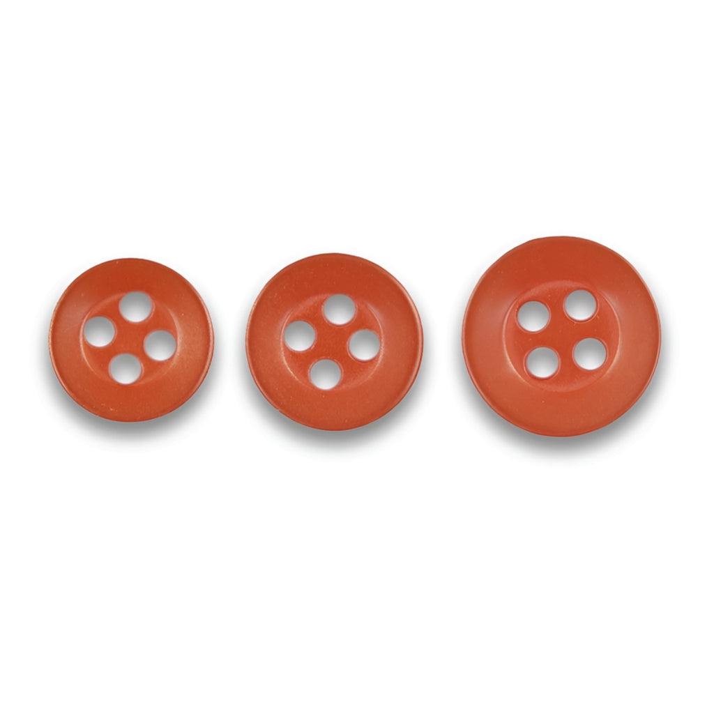 Three Replacement Shirt Buttons in matte red, each with four holes and different sizes, arranged in a row on a white background—ideal spares for any tailor's kit.