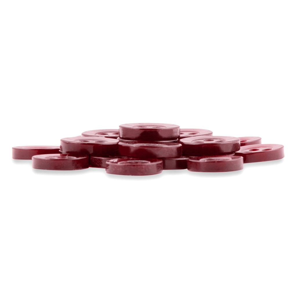 A pile of Replacement Shirt Buttons with a maroon, matte finish, stacked together on a white background.