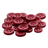 A set of red, round Replacement Shirt Buttons with four holes made from durable poly-nylon, scattered on a white background—ideal for any tailor's kit.