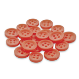 A pile of Replacement Shirt Buttons—round and orange, made from poly-nylon—ideal for a tailor’s kit, rests on a white background.