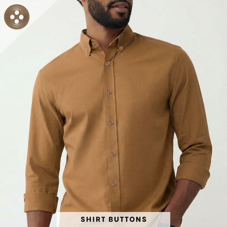 Man wearing a brown long-sleeve button-up shirt with matte finish Replacement Shirt Buttons, hands in pockets; text reads REPLACEMENT SHIRT BUTTONS.