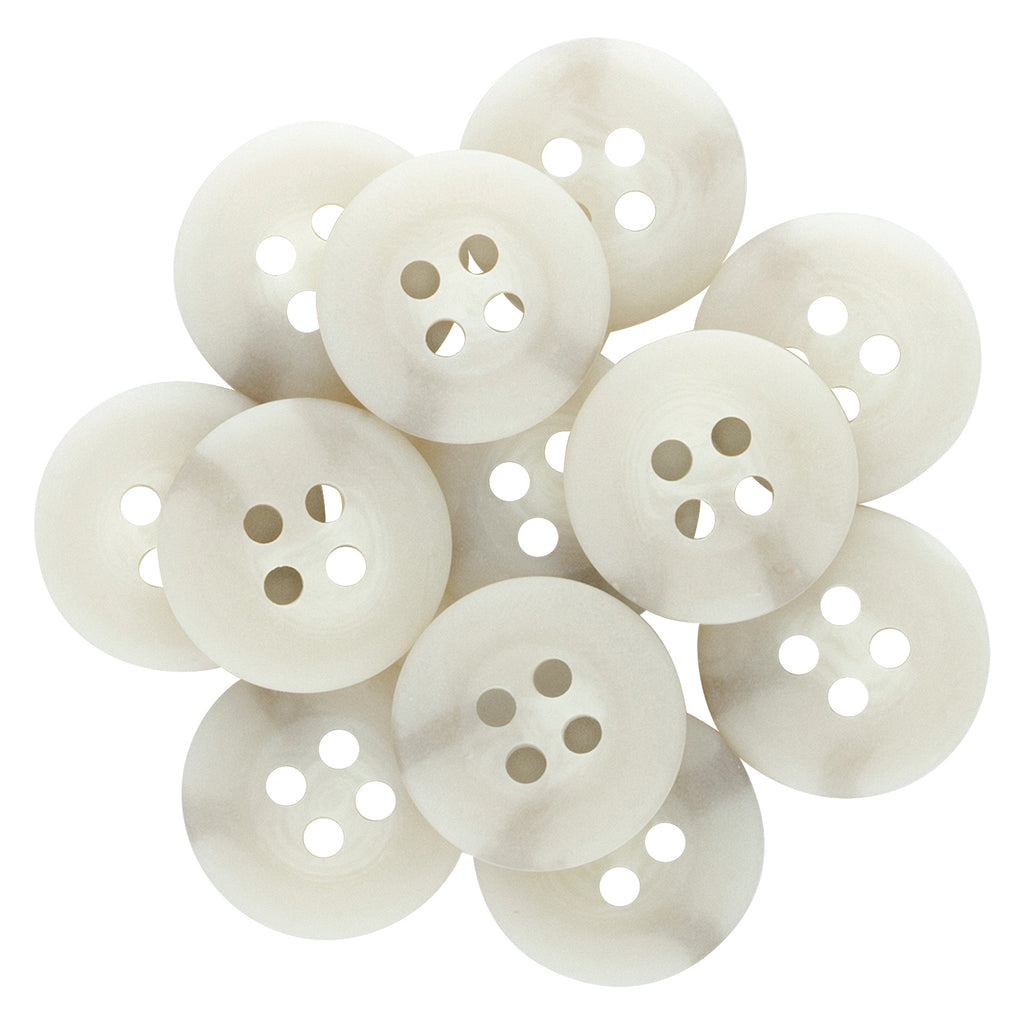 A pile of Khakis, Chinos and Casual Cotton Pant Buttons overlap each other on a white background.