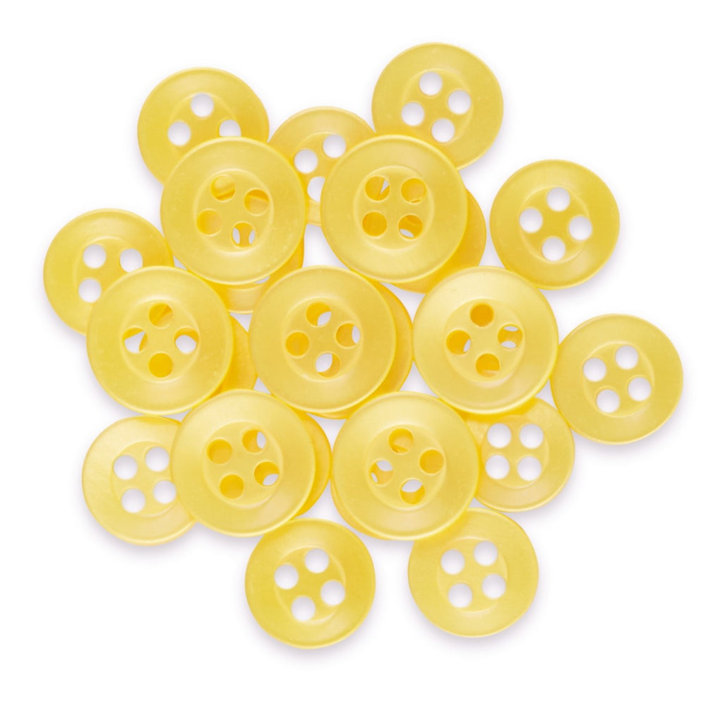 A pile of Replacement Shirt Buttons made from yellow poly-nylon with a matte finish and four holes, arranged on a white background.