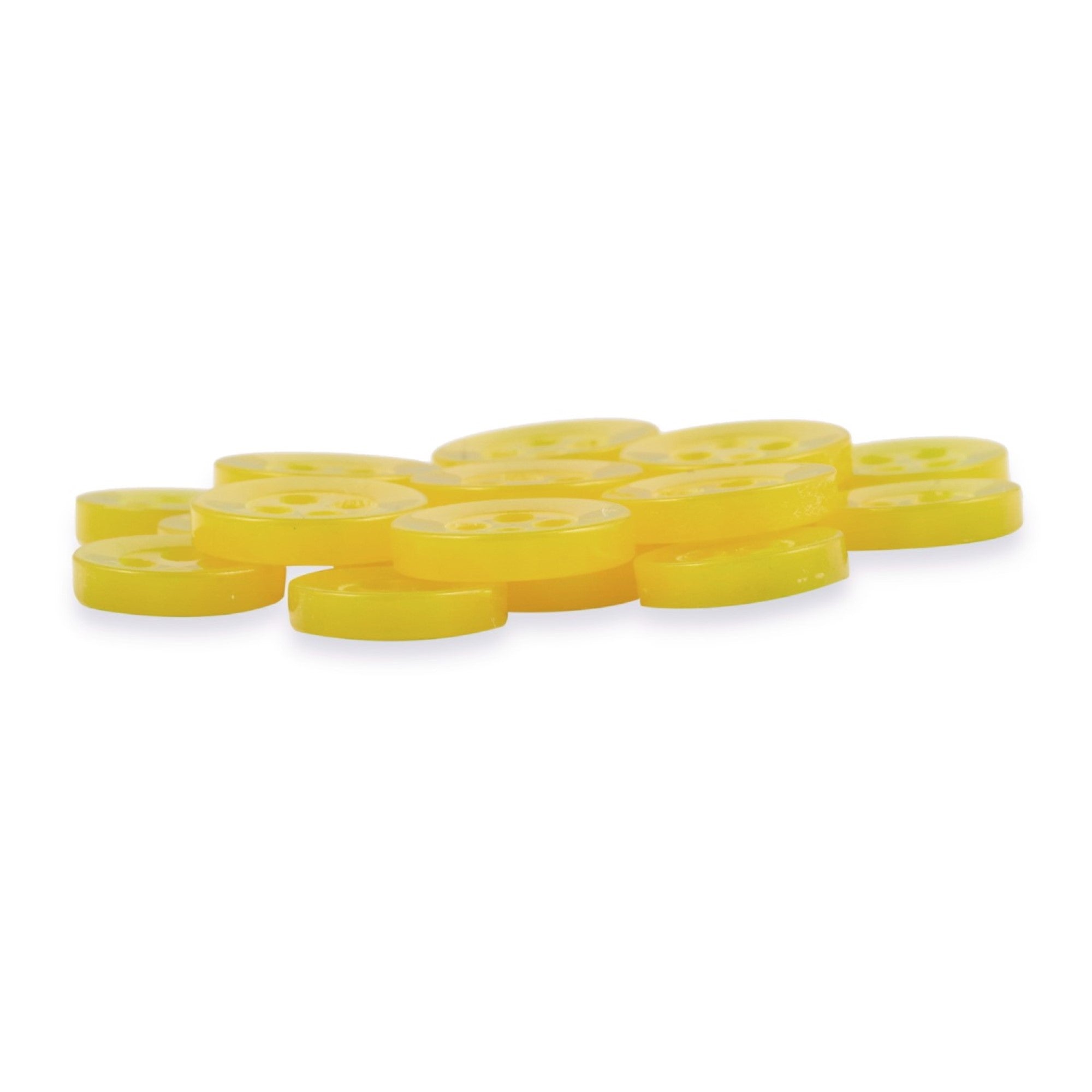 Replacement Shirt Buttons, yellow and plastic, are scattered on a white background, resembling poly-nylon tokens from a tailor's kit.
