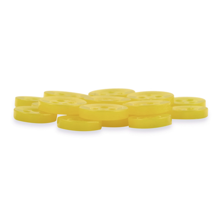 A pile of Replacement Shirt Buttons—round, flat, yellow, and durable—on a white background.