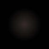 A subtle, dark circle with a blurred gradient on solid black captures the refined elegance of Buffalo Horn Suit Buttons.