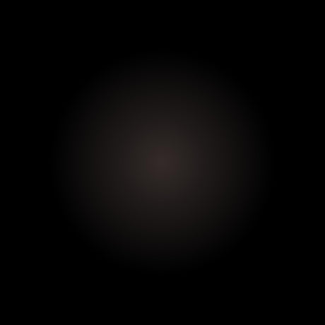 A subtle, dark circle with a blurred gradient on solid black captures the refined elegance of Buffalo Horn Suit Buttons.