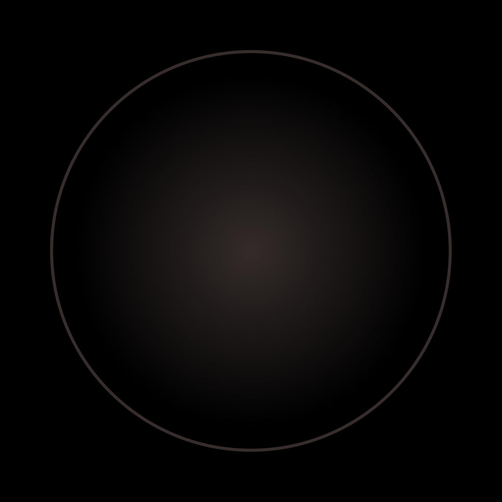 A dark circle with a subtle gradient, centered on a black background, captures the refined elegance of Buffalo Horn Suit Buttons.