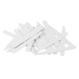 A pile of white Collar Stays, resembling tongue depressors, scattered on a white background.